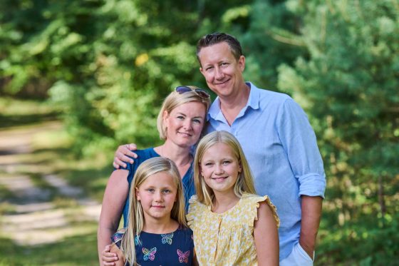 Happy family in the countryside, summer weather.