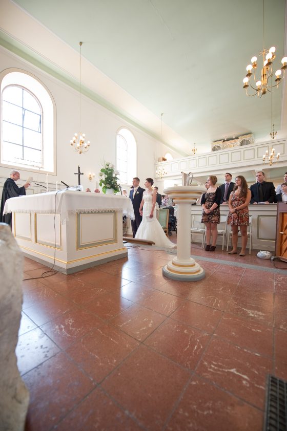 Church wedding with bridal couple and guests