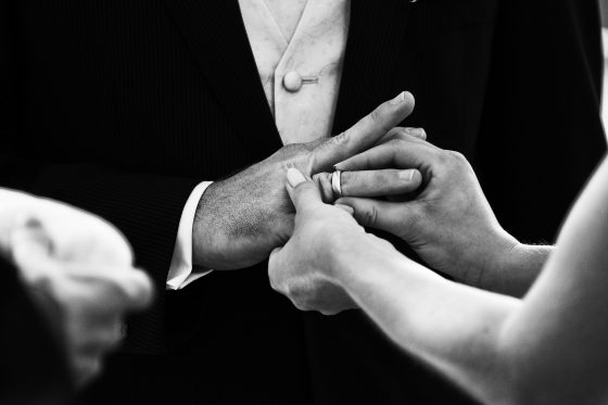 Close-up hands wringing wedding