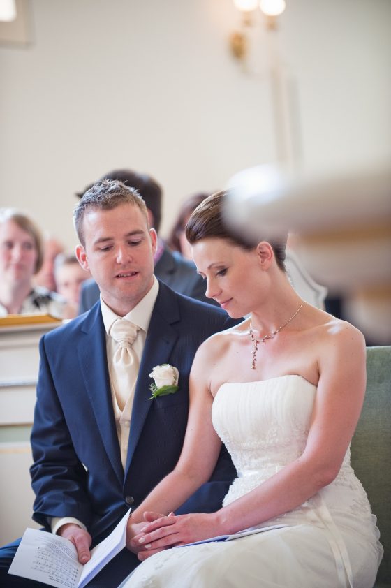 Bridal couple at the wedding ceremony in a church