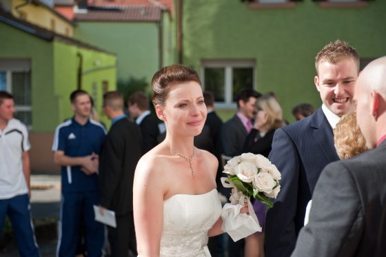 Bride with bouquet at outdoor wedding