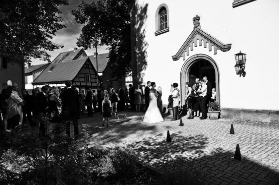 Gathering of people in front of church at wedding